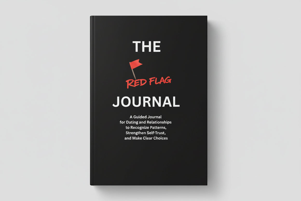 Black book titled 'The Red Flag Journal' on a textured surface