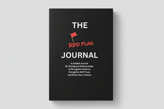 Black book titled 'The Red Flag Journal' on a textured surface